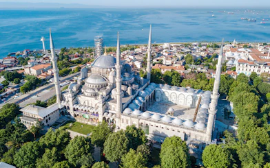 Aerial view of the Blue Mosque Sultanahmet with minarets in Istanbul, overlooking the sea.