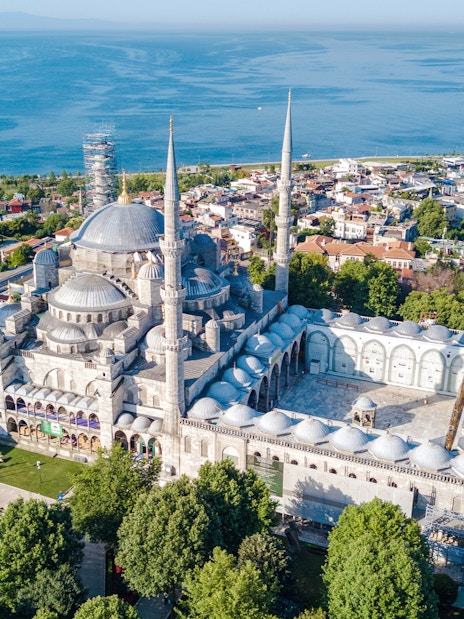 Aerial view of the Blue Mosque Sultanahmet with minarets in Istanbul, overlooking the sea.