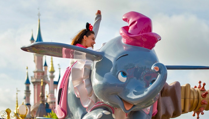 Dumbo the Flying Elephant ride at Disneyland Paris with colorful elephants in motion.