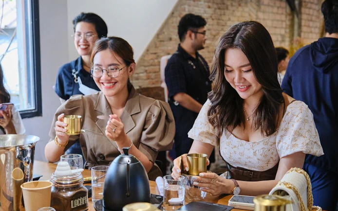 Visitors enjoying a Vietnamese coffee workshop, learning about local brewing techniques.