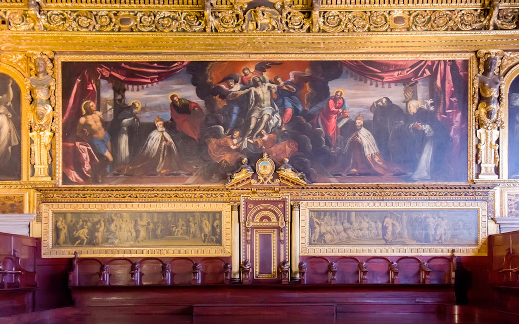 Interior artwork and ornate details of the Doge's Palace in Venice, Italy.