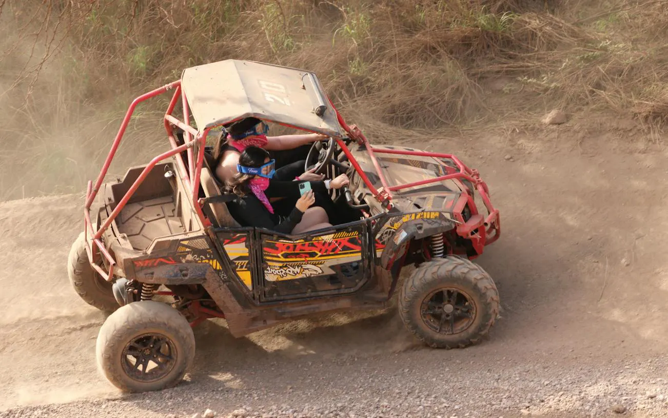 ATV navigating rugged terrain during Off-Road Adventure, Oahu.