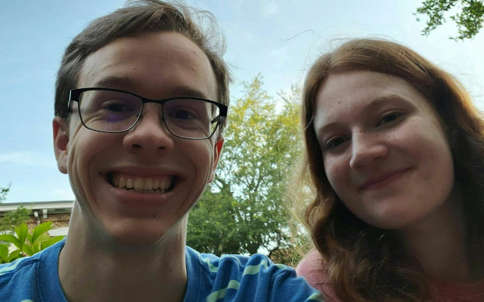 I don't know who these people are, but here's the alt text:
"Participants enjoying Ghosts of Savannah self-guided city exploration game.
