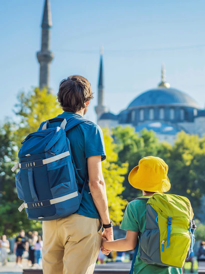 Father and son tourists viewing Blue Mosque, Sultanahmet Camii, Istanbul.