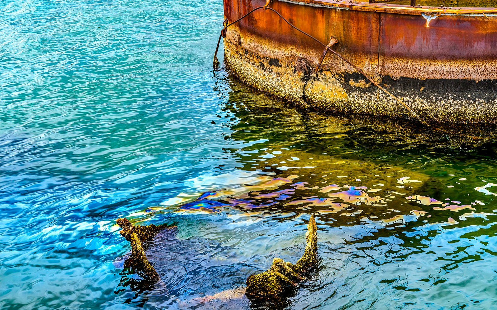 Submerged turret and oil slick at USS Arizona Memorial, Pearl Harbor.