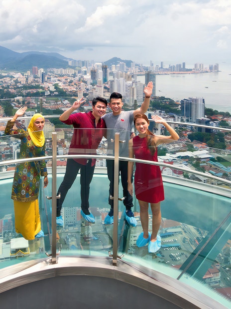 Visitors enjoying the view from Rainbow Skywalk and Observatory Deck in Penang, Malaysia.