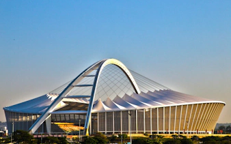 Moses Mabhida Stadium in Durban with iconic arch structure.