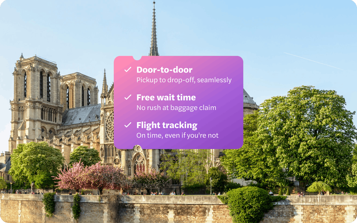 Notre Dame Cathedral with trees along the Seine River in Paris.