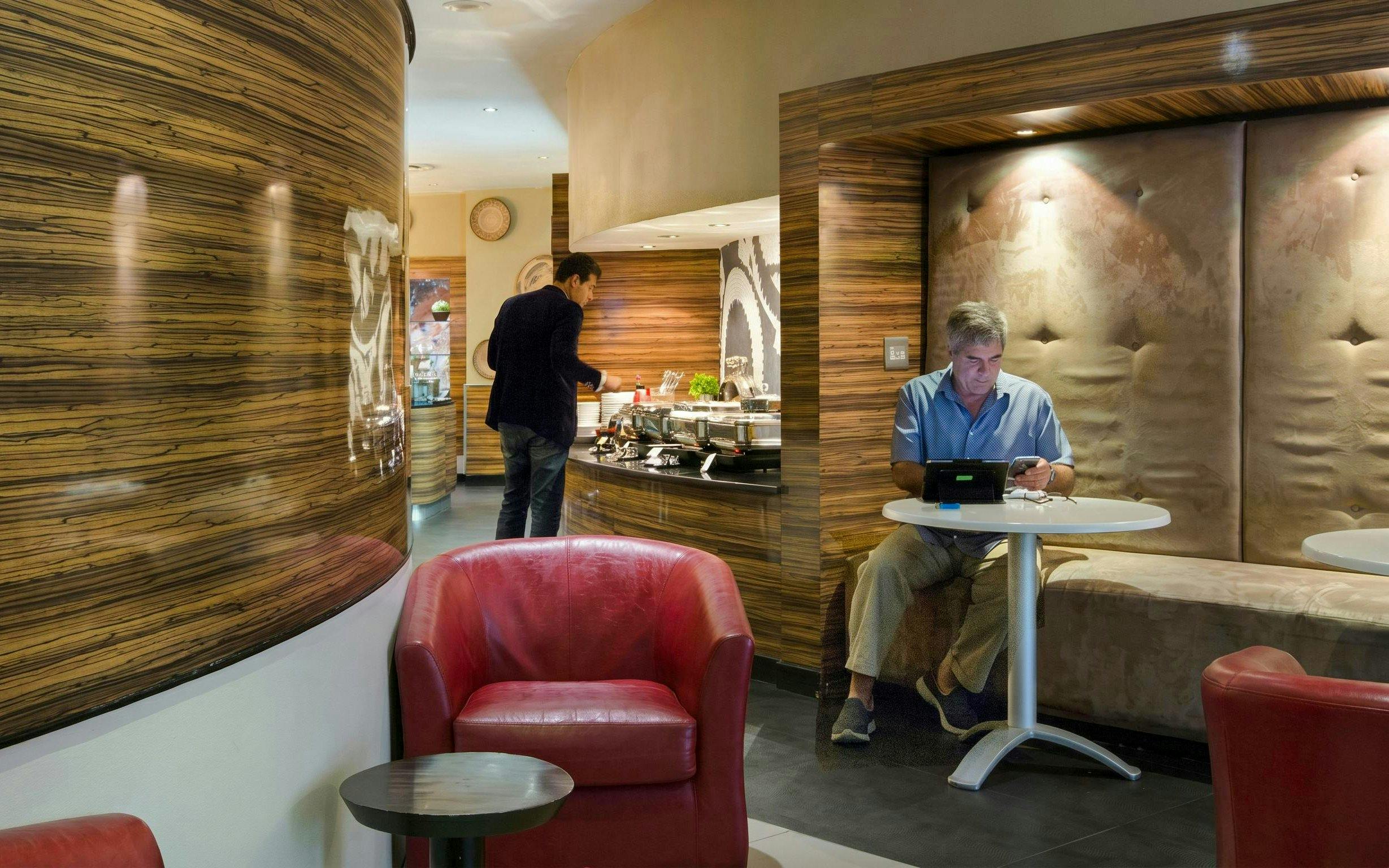Shongololo Lounge seating and buffet area at O. R. Tambo International Airport Terminal A, Johannesburg.
