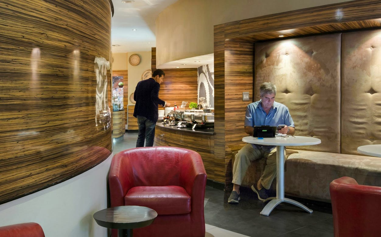 Shongololo Lounge seating and buffet area at O. R. Tambo International Airport Terminal A, Johannesburg.