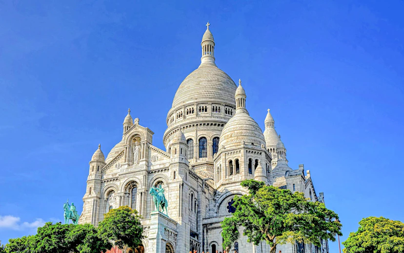 Sacre-Coeur Basilica in Montmartre, Paris, under a clear blue sky.