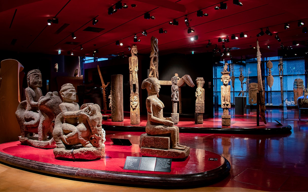 Quai Branly Museum interior with sculptures, Paris.