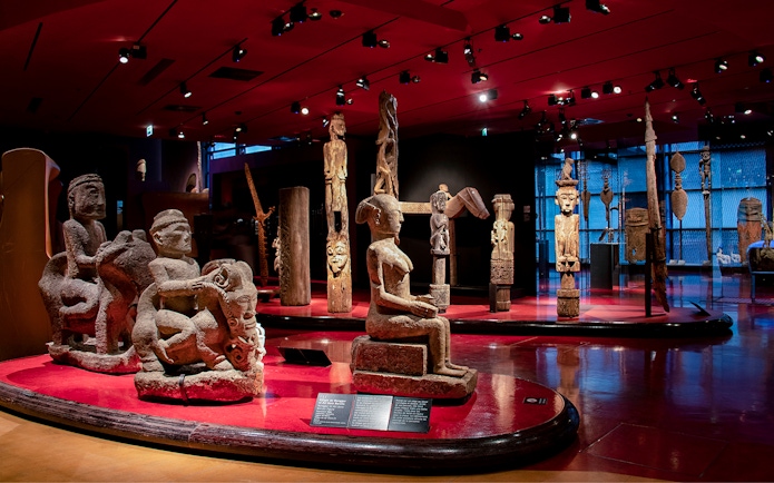 Quai Branly Museum interior with sculptures, Paris.