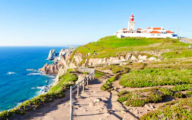 Cabo da Roca lighthouse on a cliff overlooking the Atlantic Ocean, Sintra, Portugal.