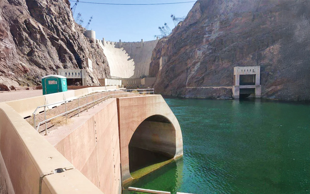 Hoover Dam with view of lower banks and Colorado River.