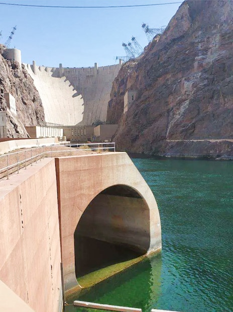 Hoover Dam with view of lower banks and Colorado River.