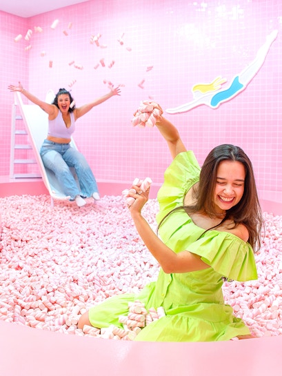 Two people enjoying a marshmallow pool at Wondr Experience.