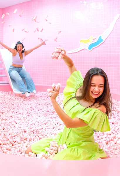 Two people enjoying a marshmallow pool at Wondr Experience.