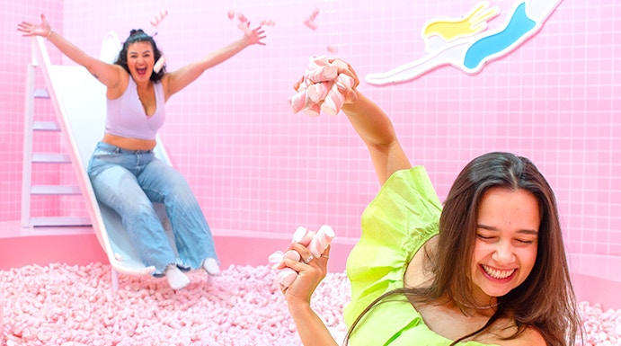 Two people enjoying a marshmallow pool at Wondr Experience.