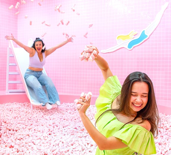 Two people enjoying a marshmallow pool at Wondr Experience.