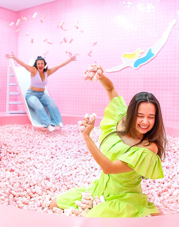 Two people enjoying a marshmallow pool at Wondr Experience.