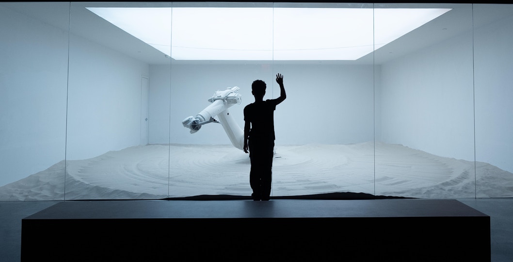Visitors exploring immersive red light exhibit at Mercer Labs, Museum of Art & Technology.