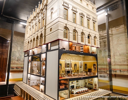 Queen Mary's Dolls' House interior at Windsor Castle, showcasing detailed miniature rooms.