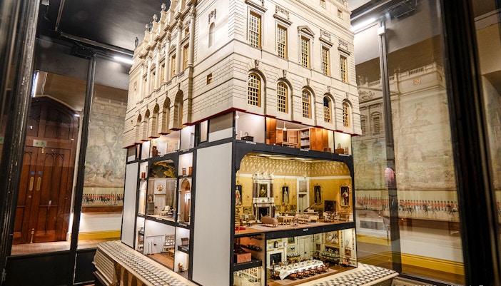 Queen Mary's Dolls' House interior at Windsor Castle, showcasing detailed miniature rooms.