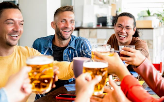 Group enjoying drinks in a Berlin café, part of the Berlin All-Inclusive Welcome Card experience.