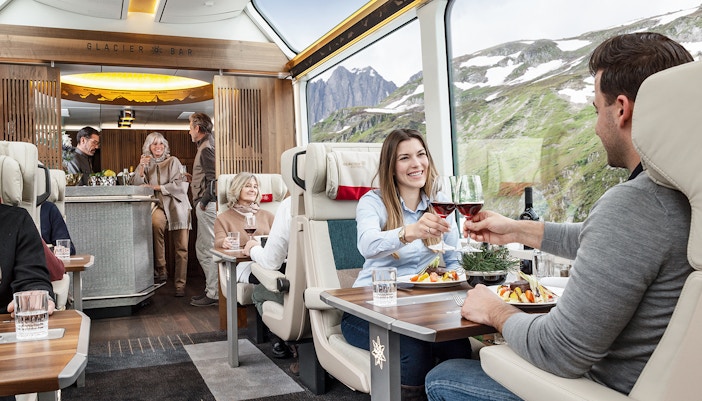 Passengers relishing meal on swiss train