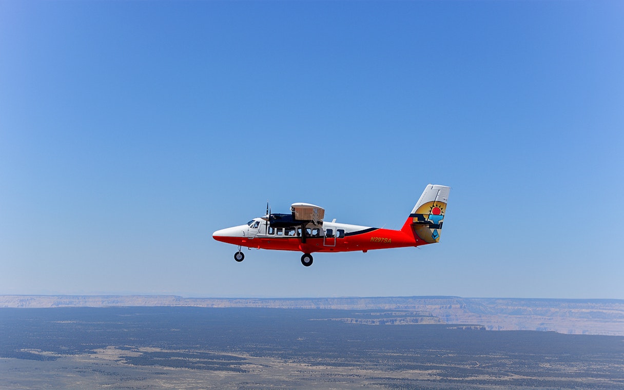 Helicopter flying over the Grand Canyon's North Rim.