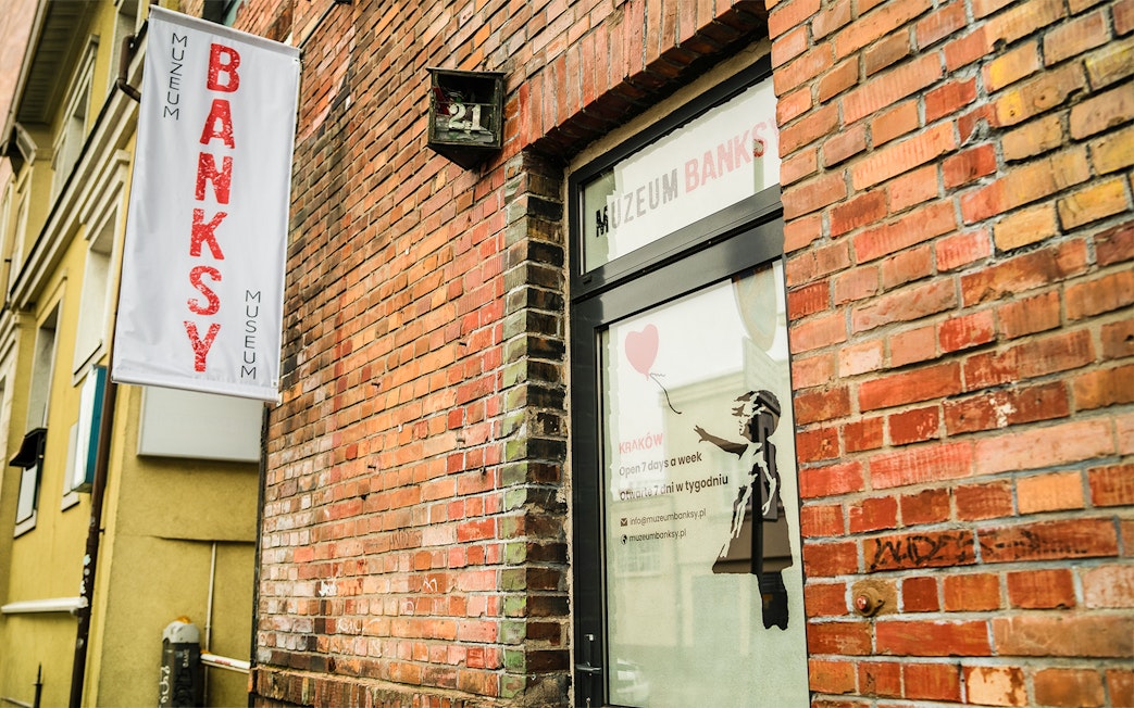 Banksy Museum entrance with street art in Krakow, Poland.