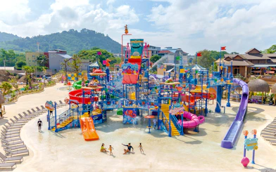 Aerial view of Andamanda Phuket water park with colorful slides and play areas.