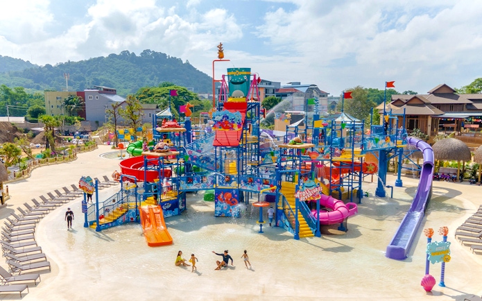 Aerial view of Andamanda Phuket water park with colorful slides and play areas.