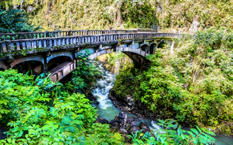Bridge over Wailua Nui Stream at Upper Waikani Falls, Road to Hana, Maui, Hawaii.