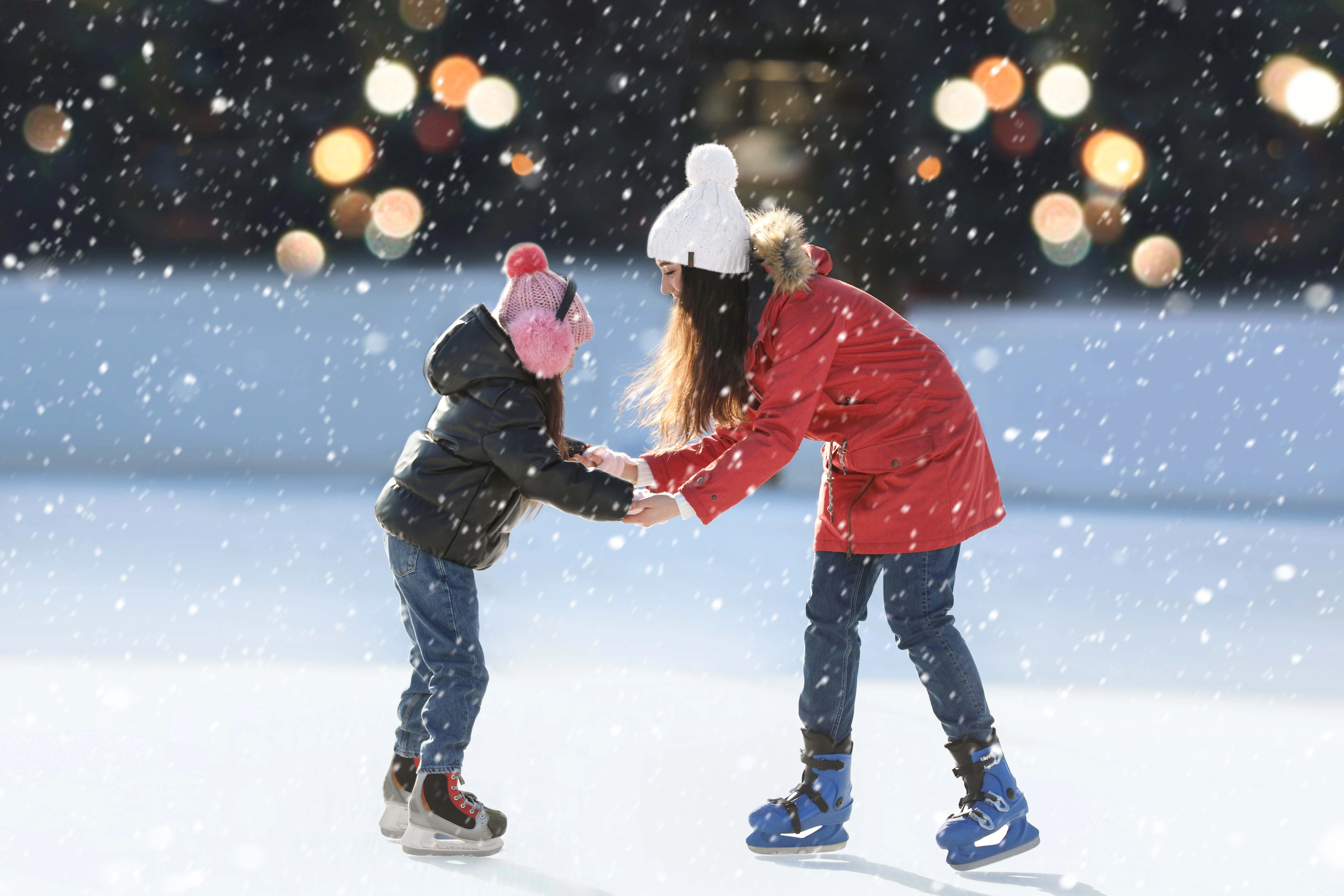 Children ice skating in Krakow during New Year celebrations.