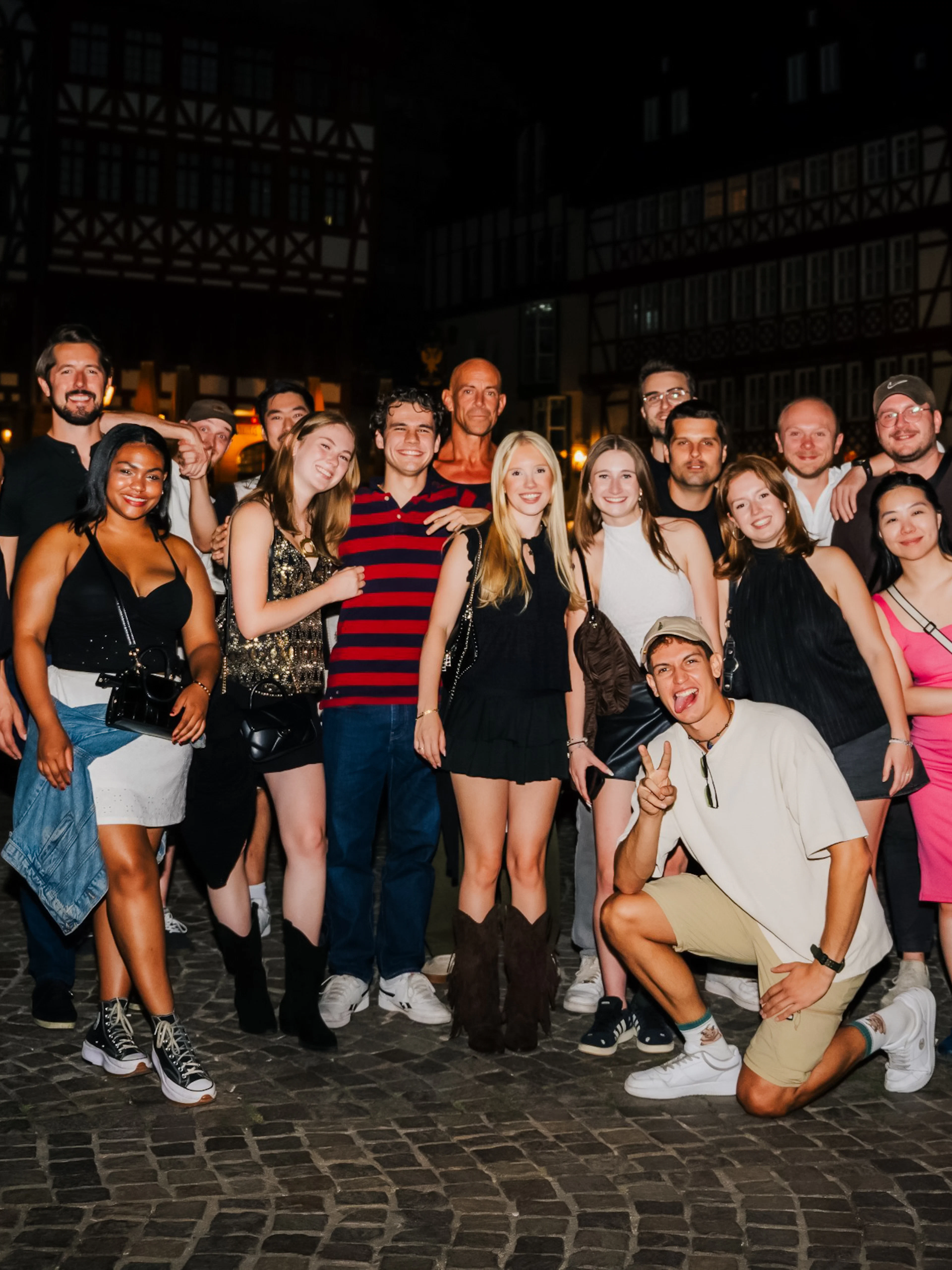 Group enjoying Berlin nightlife tour with club entry and shots.