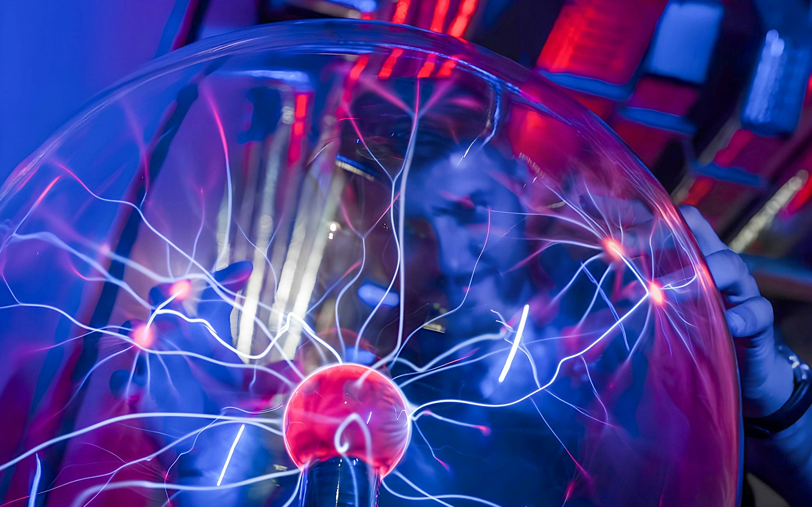 Plasma ball exhibit at DeJa Vu Museum with electric arcs.