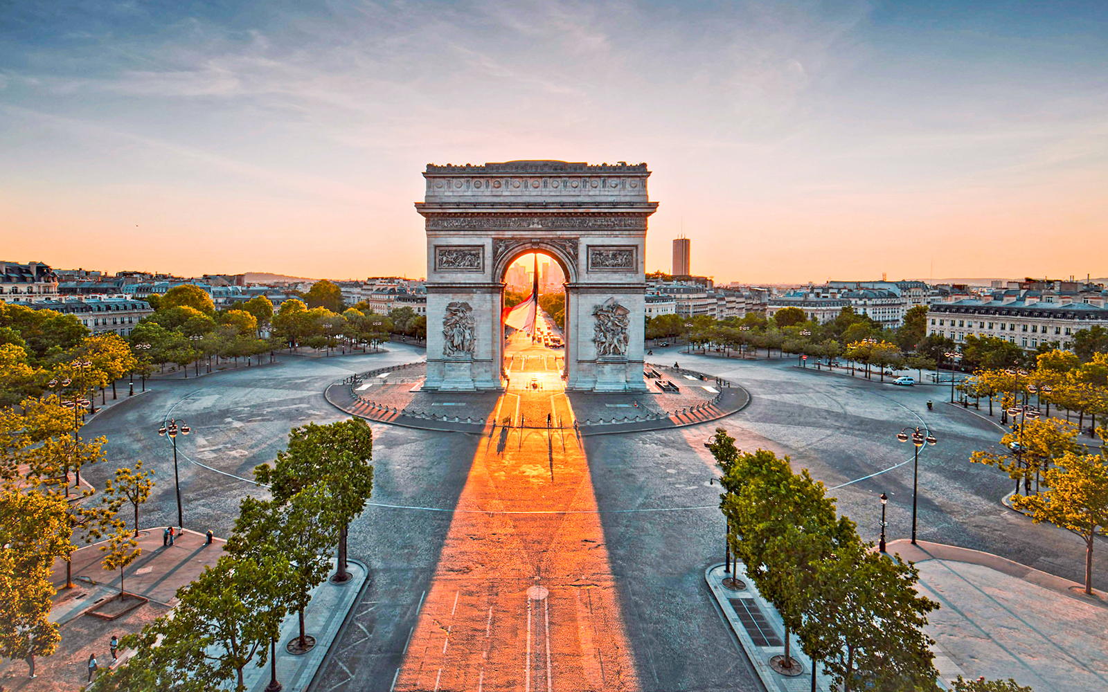 Arc de Triomphe in Paris at sunrise, view from Champs-Élysées, tour with audio guide.