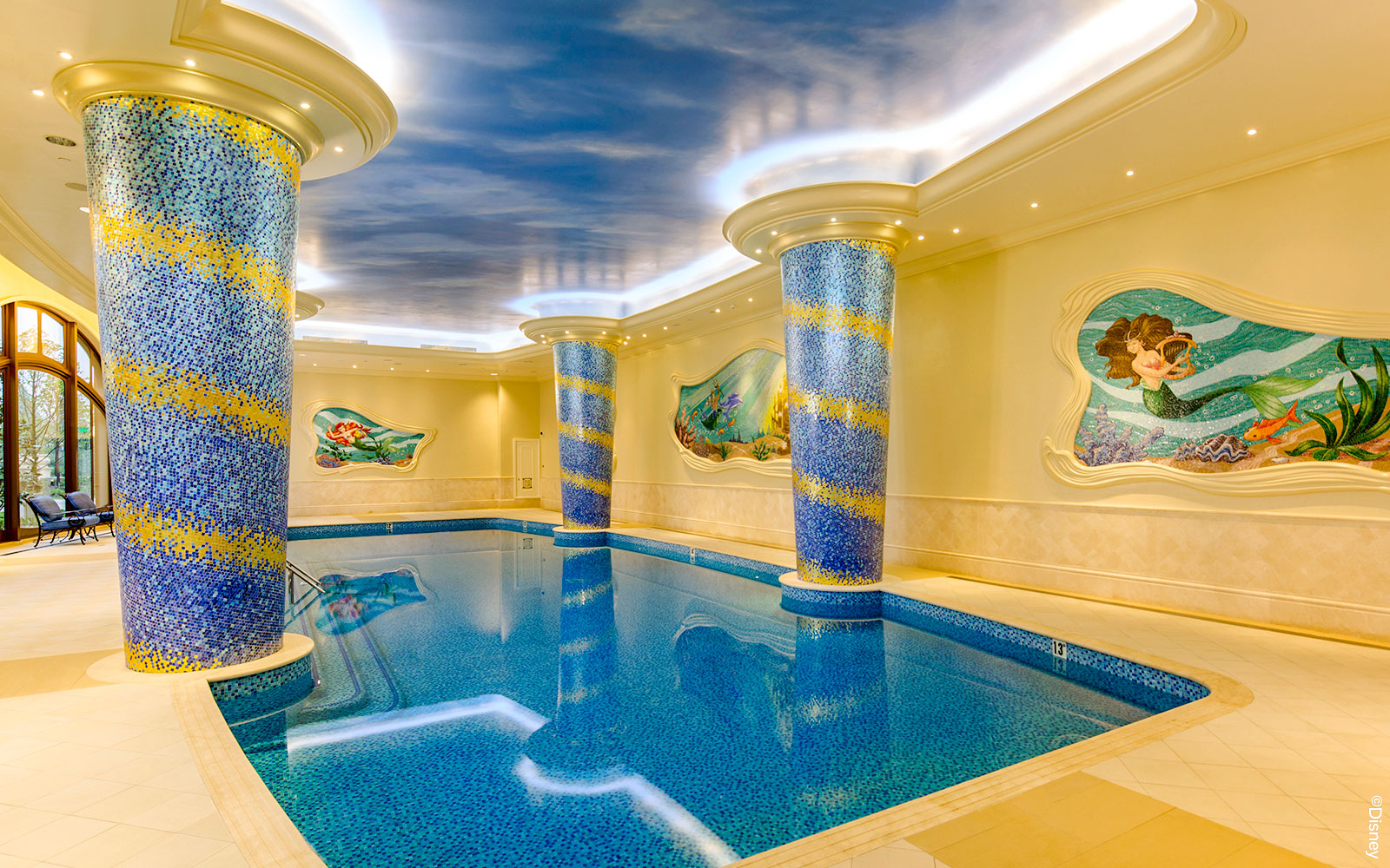 Indoor pool with mosaic columns and mermaid mural at Shanghai Disney.