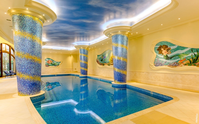 Indoor pool with mosaic columns and mermaid mural at Shanghai Disney.