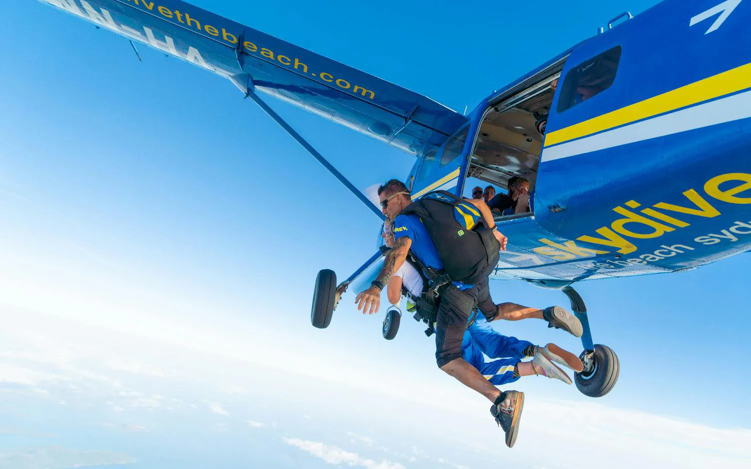 Tandem skydive jump from plane over Airlie Beach, Australia.
