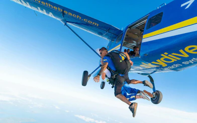 Tandem skydive jump from plane over Airlie Beach, Australia.