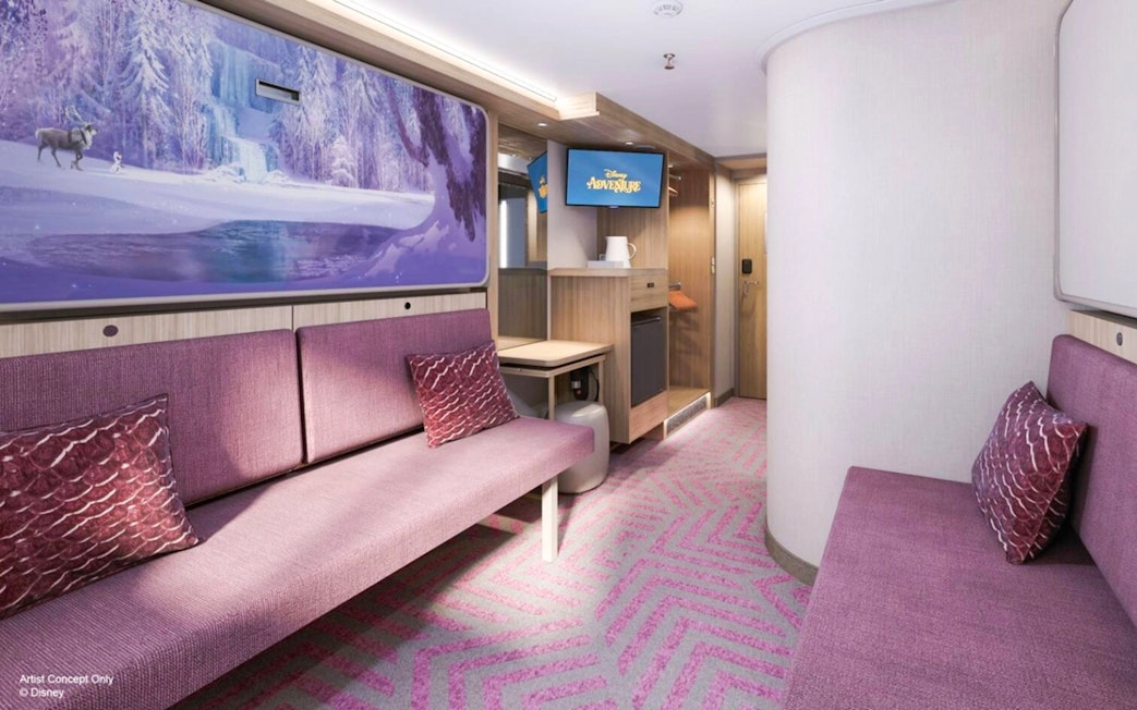 Inside stateroom with reef view on Disney Adventure Cruise, featuring purple seating and Frozen-themed artwork.