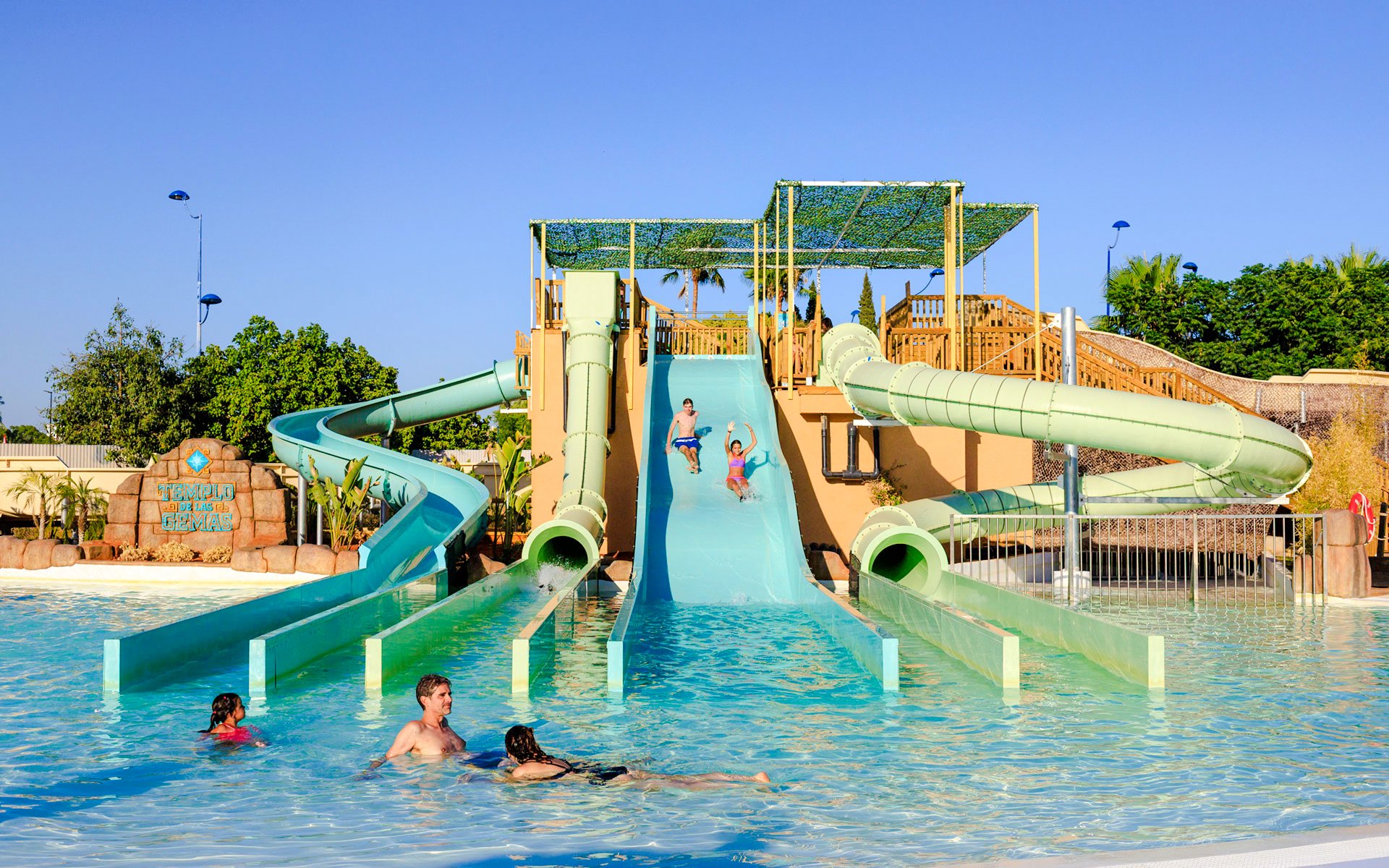 Visitors enjoying water slides at Temple of the Gems, Aqua Magica.