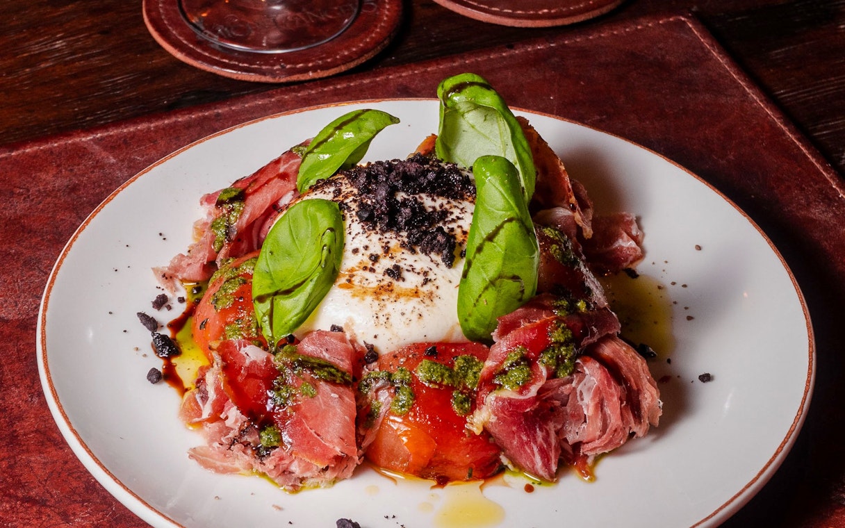 Burrata and prosciutto dish served at Michelangelo Tango Show.