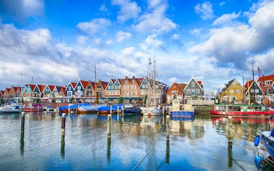 Marina and colorful waterfront houses in Volendam, Netherlands.