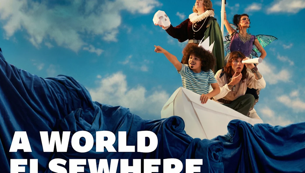 Group on paper boat with costumes, pointing and looking ahead, "A World Elsewhere Westend" theme.