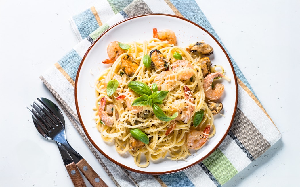 Seafood pasta with cream sauce served on Steamboat Natchez Evening Dinner Cruise.