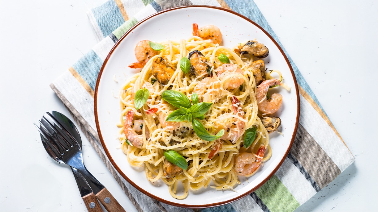 Steamboat Natchez dinner cruise pasta with seafood and cream sauce, New Orleans.